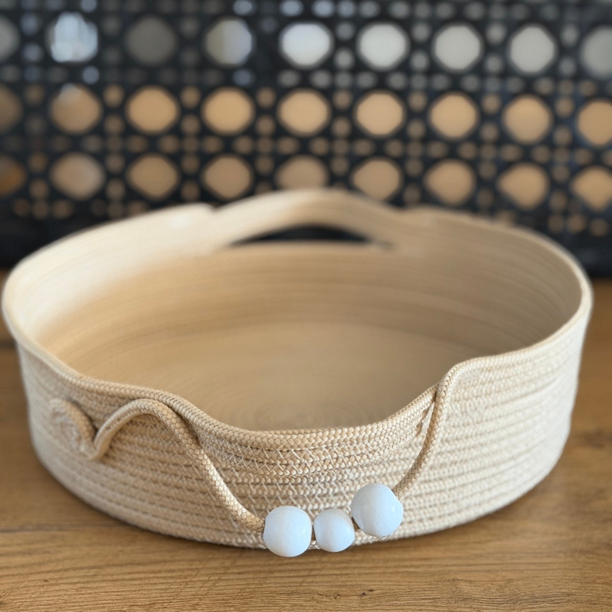 Natural rope tray with curved handles and white wooden beads