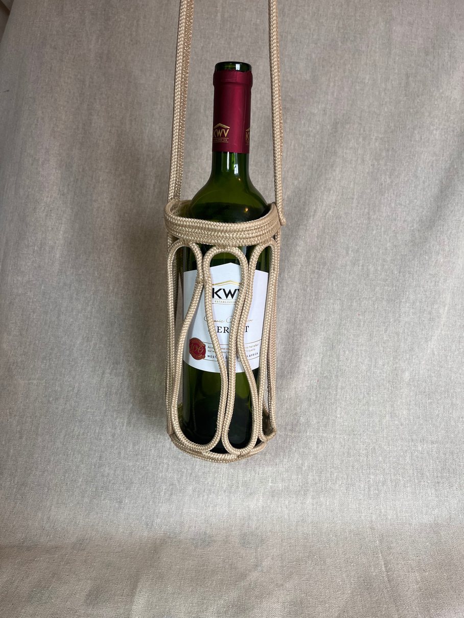 Over-the-shoulder rope wine carrier holding a bottle